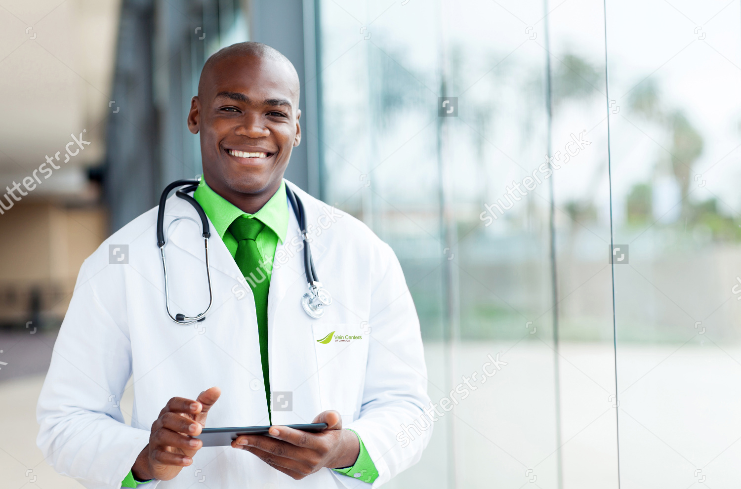 stock-photo-happy-african-male-doctor-with-tablet-computer-158379752